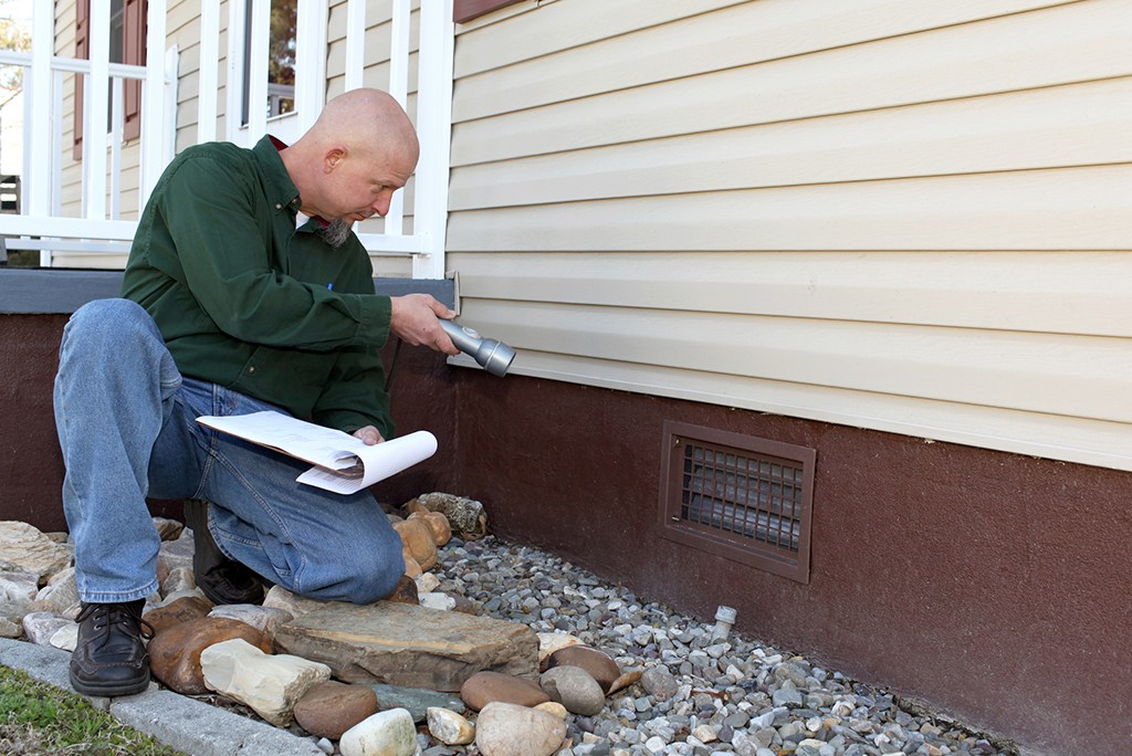 home inspector inspecting property